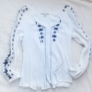 Flowy tunic blouse with blue embroidery